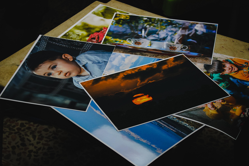 printed photos on a table