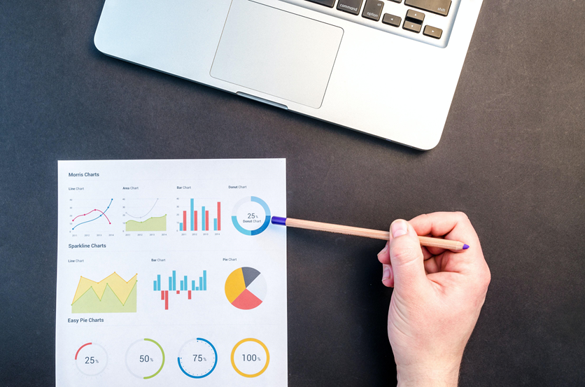 Hand pointing at data sheet with pencil